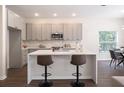 Modern kitchen with gray cabinets, white countertop, and island at 14217 Sapphire Bay Cir, Orlando, FL 32828