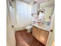 Clean bathroom with a tub shower combo and updated vanity at 154 Woodbury Pines Cir, Orlando, FL 32828