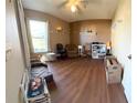 Cozy Gathering room with hardwood floors and ample natural light at 154 Woodbury Pines Cir, Orlando, FL 32828