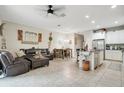 Open concept kitchen with white cabinets, granite countertops, and an island at 190 Mitchell Creek Way, Oviedo, FL 32765