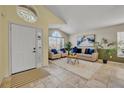 Welcoming living area with neutral tones, tile floors, and bright windows at 233 Bluejay Way, Orlando, FL 32828