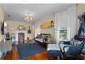 Cozy living room featuring hardwood floors, fireplace, and comfortable seating at 549 Glenway Dr, Sanford, FL 32771