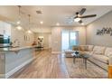 Open living space with L-shaped sofa and modern decor at 5814 Bimini Twist Loop, Orlando, FL 32819