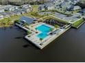 Community pool and playground, perfect for relaxation and recreation at 609 Bayhawk St, Debary, FL 32713