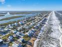 Aerial view of beachfront homes and community at 6912 S Atlantic Ave, New Smyrna Beach, FL 32169