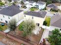 Aerial view showcasing a home's backyard patio and surrounding houses at 8747 Isla Bella Dr, Orlando, FL 32818