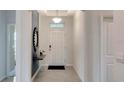 Bright and airy foyer with contemporary decor at 1688 Three Bars Rd, Kissimmee, FL 34744