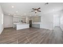 Open concept kitchen with gray cabinets and island at 1707 Merthie Dr, Sanford, FL 32771