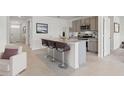 Modern kitchen with granite island and stainless steel appliances at 1723 Three Bars Rd, Kissimmee, FL 34744