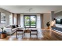 Bright and airy living room featuring a comfortable sectional sofa and large windows at 2011 University Dr, Orlando, FL 32804