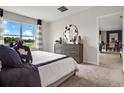 Bright bedroom with a view and stylish decor at 2118 Red Rock Rd, New Smyrna Beach, FL 32168