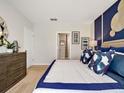 Comfortable bedroom with en-suite bathroom access at 2118 Red Rock Rd, New Smyrna Beach, FL 32168