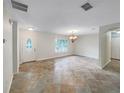 Spacious dining area with tiled floors and a chandelier at 224 Alpine St, Altamonte Springs, FL 32701