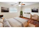 Large bedroom with hardwood floors, a dresser, and a ceiling fan at 224 Alpine St, Altamonte Springs, FL 32701