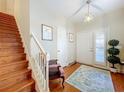 Elegant wooden staircase with a white railing in a home at 2244 N Wekiva Village Ln, Apopka, FL 32703