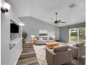 Spacious living room featuring a neutral color palette and plenty of natural light at 3201 S Dorchester Dr, Deltona, FL 32738
