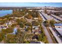 Aerial view showcasing the home's location near a lake and city skyline at 3817 Bainbridge Ave, Orlando, FL 32839