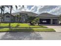 Two-car garage and house exterior view at 4726 Combahee Ln, Orlando, FL 32837