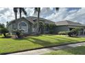 House exterior showcasing landscaping and driveway at 4726 Combahee Ln, Orlando, FL 32837