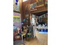 Colorful and eclectic dining area with various artwork and plants at 5302 Burning Tree Dr # F-02-2, Orlando, FL 32811
