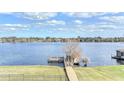 Lakefront property with a dock and a peaceful view at 632 Long Lake Dr, Oviedo, FL 32765