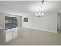 Spacious dining room with tile floors and large window at 1319 N Old Mill Dr, Deltona, FL 32725