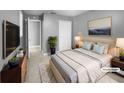 Spacious bedroom with wood-like floors and neutral decor at 1350 Bailey Ave, Deltona, FL 32725