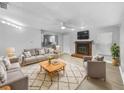 Bright living room featuring a fireplace and comfortable seating at 1350 Bailey Ave, Deltona, FL 32725