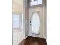 Front door entryway with wood floor and white door at 164 Brad Cir, Winter Haven, FL 33880
