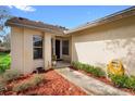 House exterior showcasing a walkway to the front door and neatly landscaped yard at 180 Hill St # 180, Casselberry, FL 32707