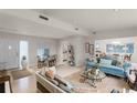 Open living area with seating, dining areas, and access to kitchen at 3431 Wilder Ln, Orlando, FL 32804