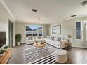 Bright living room featuring a sectional sofa, coffee table, and stylish rug at 4047 Sw 51St Ct, Ocala, FL 34474