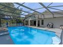 Screened-in pool and patio area, perfect for outdoor entertaining at 4938 Raylene Way, St Cloud, FL 34771