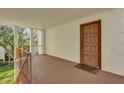 Condo entryway with brown door and small balcony at 526 Orange Dr # 37, Altamonte Springs, FL 32701
