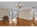 Bright living room with hardwood floors and sliding doors to balcony at 526 Orange Dr # 37, Altamonte Springs, FL 32701