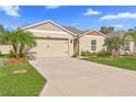 Attractive house with a two-car garage and neatly landscaped yard at 5681 Arlington River Dr, Lakeland, FL 33811