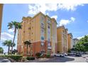 Beautiful exterior of a condo building overlooking the water at 8755 The Esplanade # 103, Orlando, FL 32836