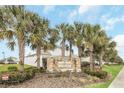 Compass Landing community entrance with stone signage and palm trees at 936 Jetway Street, Orange City, FL 32763