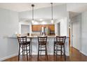 Kitchen features a breakfast bar and stainless steel appliances at 9908 Fairway Cir, Leesburg, FL 34788