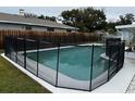 Inviting swimming pool with a safety fence at 102 Aberdeen Dr, Fern Park, FL 32730