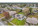 Aerial view of a house with solar panels in a neighborhood at 1113 Matterhorn Street, Deltona, FL 32725