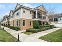 Tan townhome community with a sidewalk and manicured landscaping at 1267 Marley Ln, Winter Springs, FL 32708