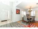 Dining room area with chandelier lighting and view of the entry at 1369 Black Willow Trl, Altamonte Springs, FL 32714