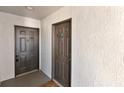 Condo entry with two doors and neutral colored walls at 13839 Fairway Island Dr # 1122, Orlando, FL 32837