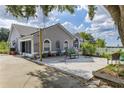 Paver patio with seating, perfect for outdoor entertaining and relaxation at 17901 Coralwood Ln, Groveland, FL 34736