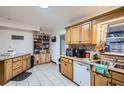 Bright kitchen with wood cabinets, stainless steel appliances, and ample counter space at 1817 W Grant St, Orlando, FL 32805