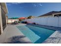 Inviting rectangular pool with patio furniture and a fenced backyard at 2518 Hayden Valley St, Apopka, FL 32703