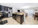 Spacious kitchen featuring granite countertops and stainless steel appliances at 2873 Sunstone Dr, Kissimmee, FL 34758