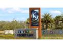 Story Lake community entrance sign with palm trees at 2952 Protagonist St, Kissimmee, FL 34746