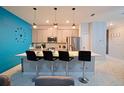 Modern kitchen with breakfast bar and stainless steel appliances at 2952 Protagonist St, Kissimmee, FL 34746